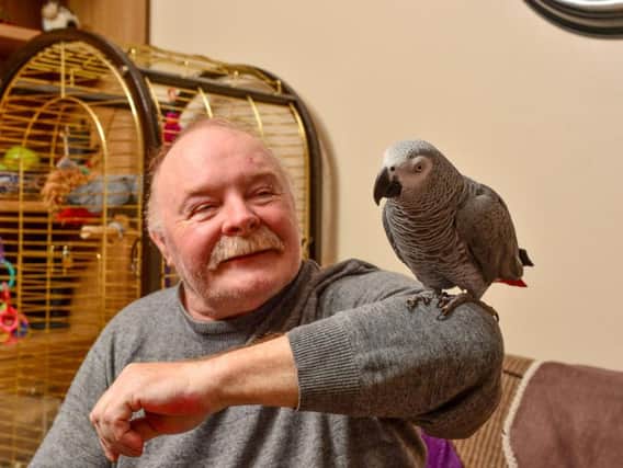 Steve Dockerty, 63, with his parrot Jazz