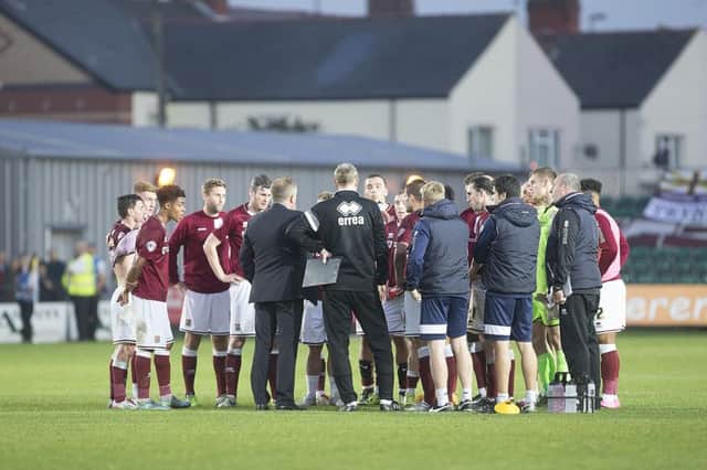 Town's players and staff get together for a huddle at full-time on their last visit to south Wales