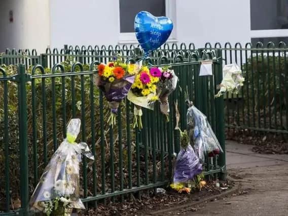 Seven bunches of flowers and a heart-shaped blue balloon were left by the railings where the incident took place.