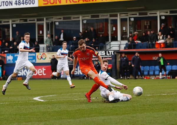 Joe Bunney produces a superb challenge on Luton's Jack Stacey. Picture: Liam Smith