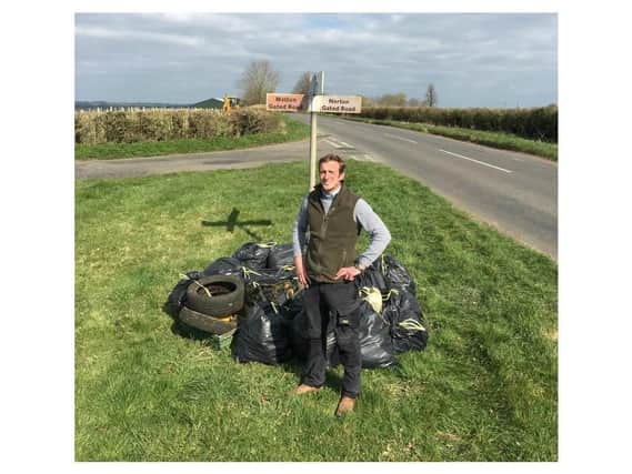 Joe Adams is pictured with one-tenth of the 181 bin bags of rubbish - this haul was collected in one day on 300 metres of the B4036 between Daventry and Long Buckby