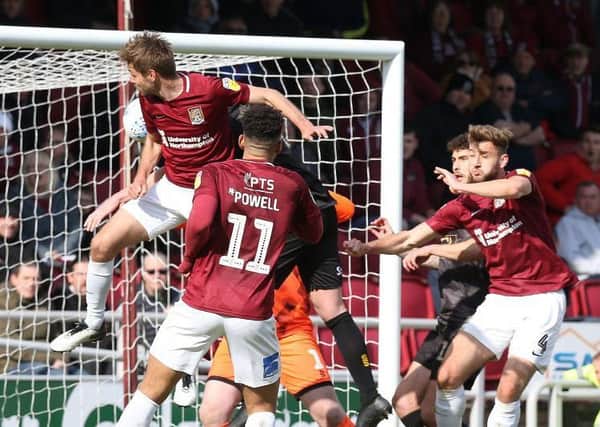 Sam Foley heads in another set-piece goal for the Cobblers. Picture: Pete Norton