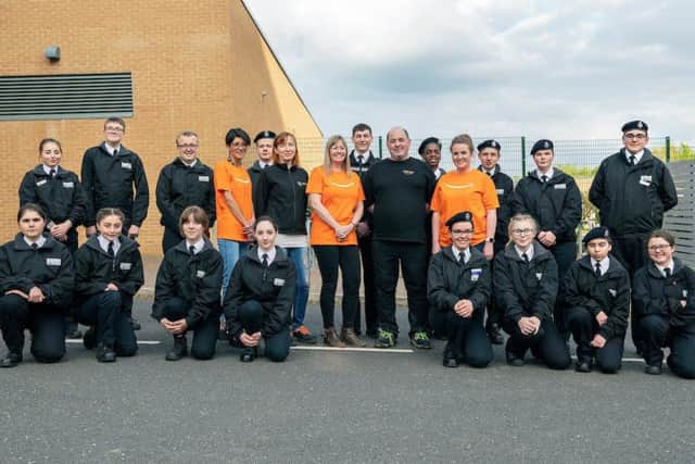 29 APRIL 2019  PARKER E-ACT ACADEMY, THE RANDOLPH BUILDING, ASHBY ROAD, DAVENTRY. NN11 0QE

Staff from Amazon visit the Northampton Emergency Cadets following a recent donation.
The associates 'fall-in' to a drill session and learn how to parade and march.
Amazon aasociates (l-r from first orange t-shirt) Corina Nuca (corinnuc), Natalja Bubani (bubann), Rachel Norris (kelrache), Alyn Surrindge (asurridg) and Lauren Steeples (conneely). Behind Rachel Norris and Alyn Surridge is Cadet George Iacovides, the eldest cadet leads the group.

PHOTOGRAPH BY RICHARD GRANGE / UNP (United National Photographers).