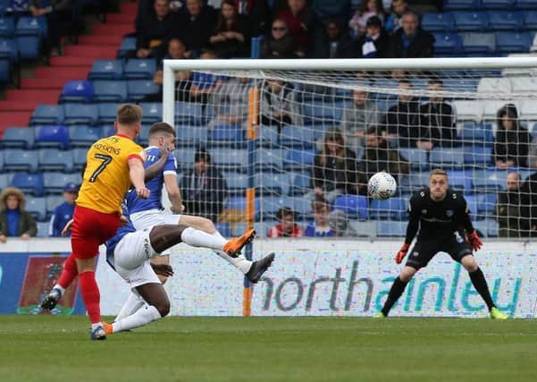 Sam Hoskins smashes into the top corner against Oldham. Picture: Pete Norton