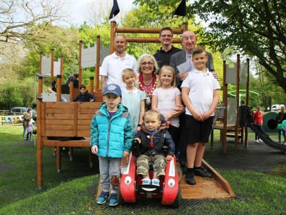 Youngsters are joined by councillors at the official opening of the new play area last month