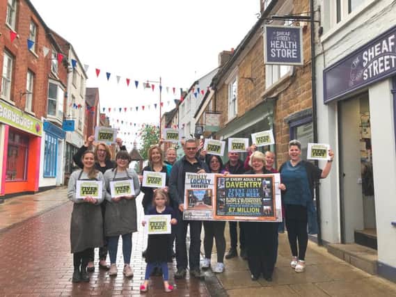 Some of Daventry's independent retailers, pictured here in Sheaf Street in town, getting ready for the Fiver Fest campaign this weekend.