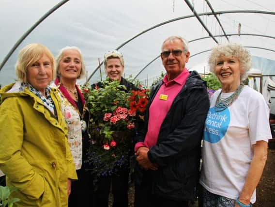 From left: NGS county organiser Gay Webster, Cllr Cecile Irving-Swift, Daventry Cummins employee and Green Health volunteer Kelly Walsh, NGS county organiser David Abbott and Sanchia Redston, of the Green Health Project, at their community allotment in Daventry.