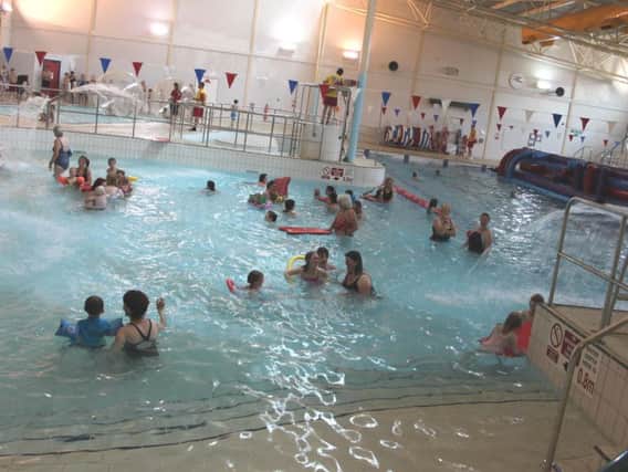Families enjoyable the inflatables at Daventry Leisure Centre.