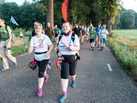 Pat (left) walked 100 miles in four days