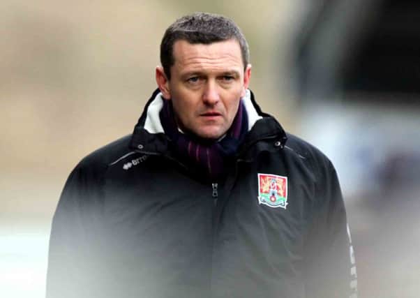 ALL CHANGE - Cobblers boss Aidy Boothroyd will tinker with his tactics for the trip to Morecambe on Tuesday night