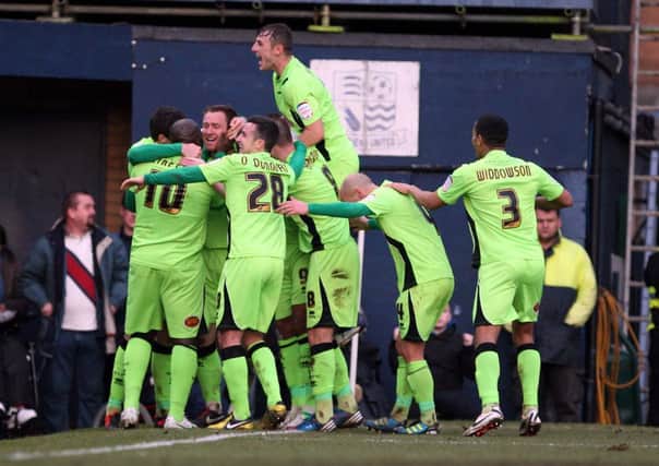 MORE OF THIS PLEASE - the Cobblers players celebrate Kelvin Langmead's late winner at Southend United last month