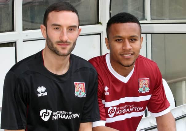 NEW LOOK - winger Chris Hackett (left) models the new Cobblers away kit for next season, while Joe Widdowson shows off the new home kit (Picture: Kirsty Edmonds)