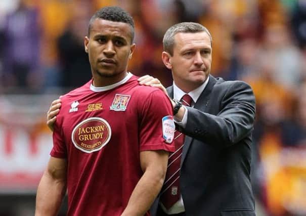 SAD END - Joe Widdowson is consoled by manager Aidy Boothroyd following the Cobblers' play-off final defeat to Bradford City