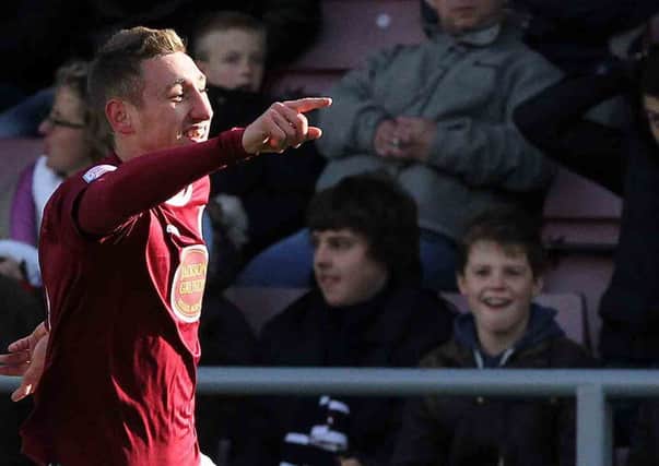HIGH POINT - Louis Moult celebrates scoring for the Cobblers in the 2-0 win over Port Vale last season