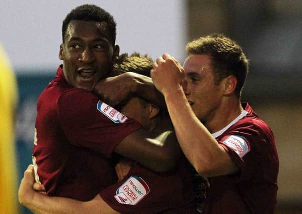 The Cobblers players celebrate Jake Robinson's goal in the 1-0 Johnstone's Paint Trophy win over MK Dons last season