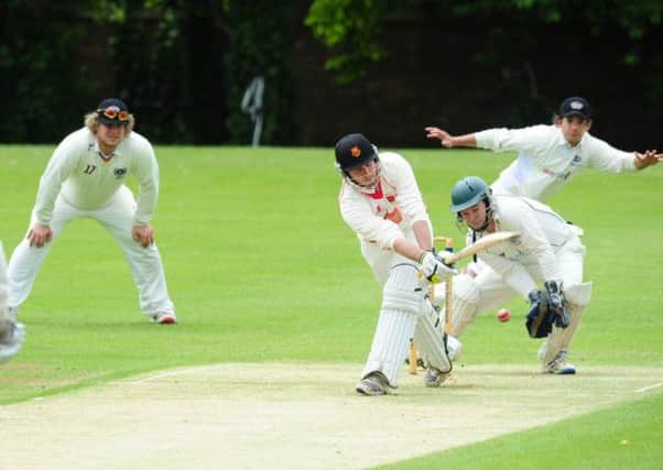 ON THE SWEEP - Steve Brooks bats for Oundle in their premier division defeat to Peterborough