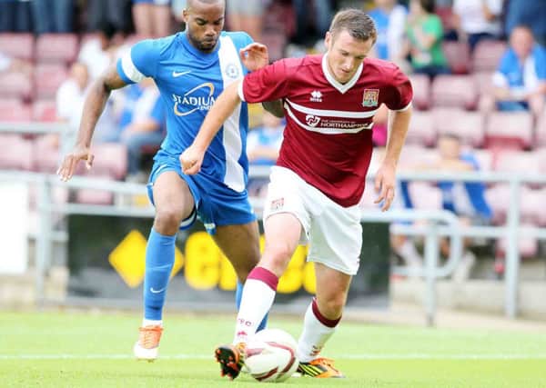 CENTRAL ROLE - Lee Collins is enjoying his partnership with Ben Tozer in the heart of the Cobblers defence (picture by Kirsty Edmonds)