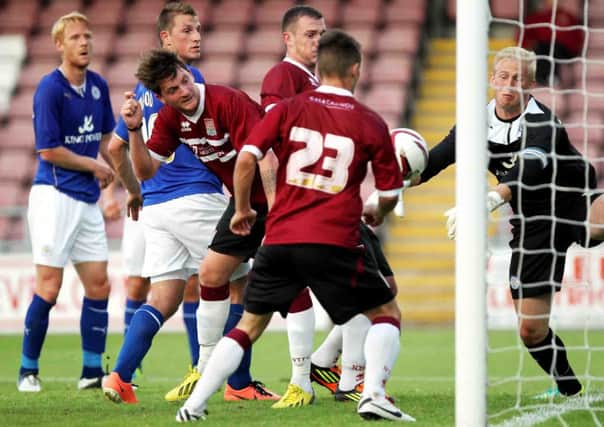 GOALMOUTH SCRAMBLE - action from Cobblers' 2-1 friendly win over Leicester City (Pictures: Kirsty Edmonds)