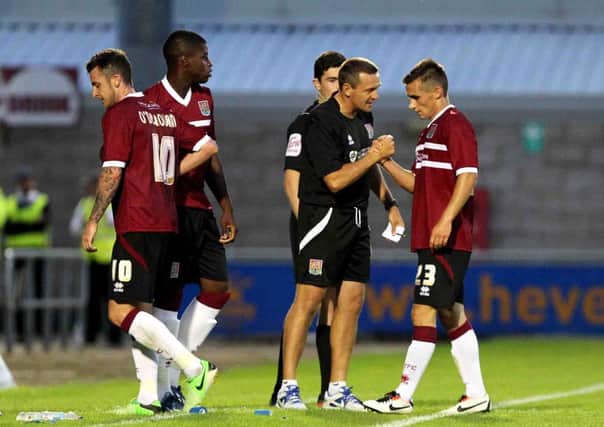 IMPRESSED - Cobblers boss Aidy Boothroyd congratulates Danny Emerton following the trialist's performance 2-1 win over Leicester (Pictures: Kirsty Edmonds)