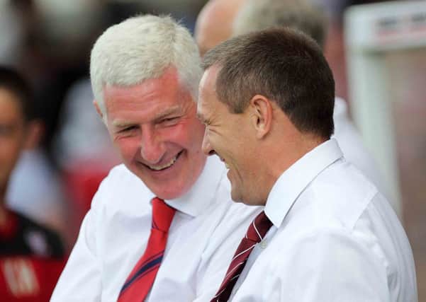 OLD PALS - Nigel Worthington and Aidy Boothroyd share a joke during the Cobblers' clash at York City on Saturday (picture: Sharon Lucey)
