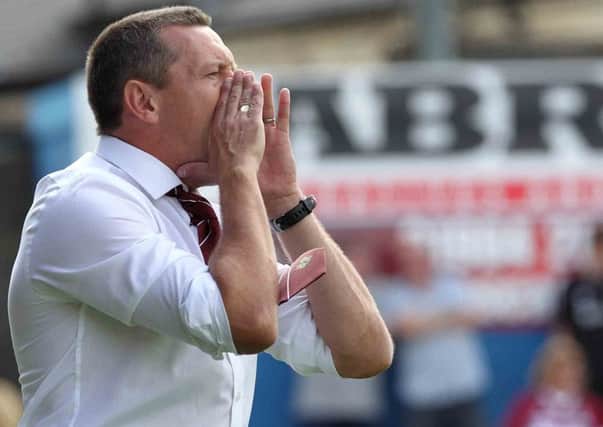 HAPPY WITH HIS SQUAD - Cobblers boss Aidy Boothroyd