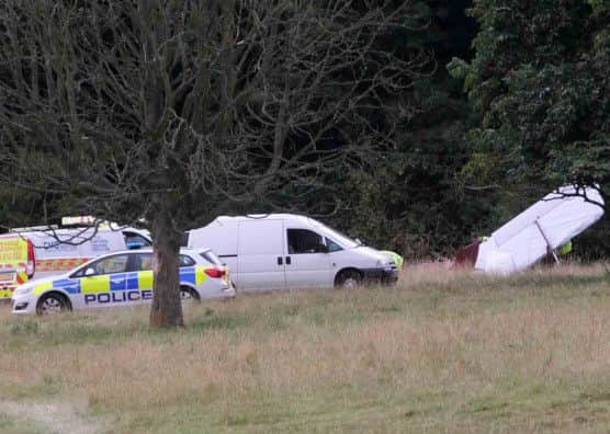 Police at the scene of the plane crash in Canons Ashby.