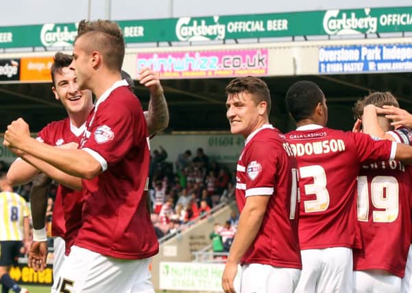 Cobblers players celebrate Jacob Blyth's opener against Torquay (picture: Kirsty Edmonds)