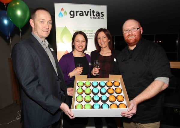 The launch of Gravitas HR Solutions at The Campanile Hotel in Grange Park. 
Mark Exley, Karen Teago and Dawn Exley from Gravitas HR Solutions with Ben Frazer who was a competitior in the Great British Bake Off, holding some of his cupcakes made for the event.