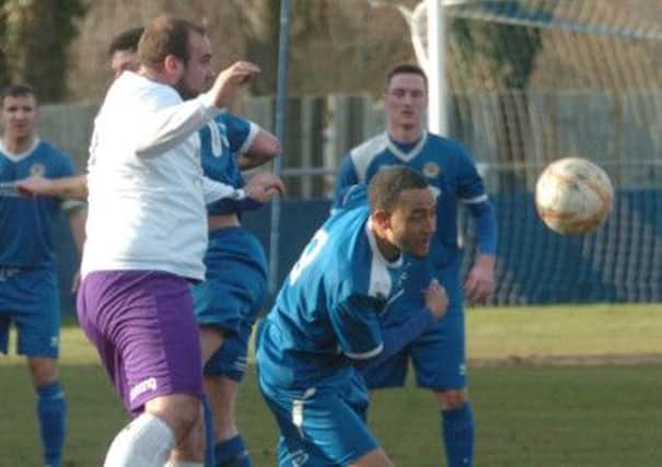 SOLID - Daventry's Liam Dolman in defensive action during Town's 2-1 win at Barton Rovers last Saturday