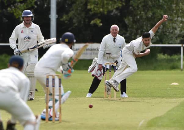 ON TARGET - Afaq Babar in bowling action for Old Northamptonians in their win over Wollaston (Picture: Dave Ikin)