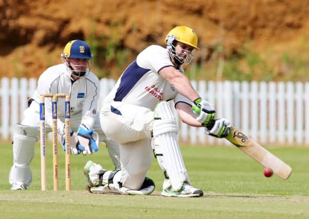 HITTING OUT - Fred Newborough in his way to an unbeaten 50 for Brixworth against Finedon (Picture: Kirsty Edmonds)