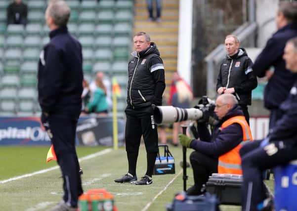 NOT HAPPY - Cobblers boss Chris Wilder watches his team lose to Plymouth on Saturday (Picture: Kirsty Edmonds)