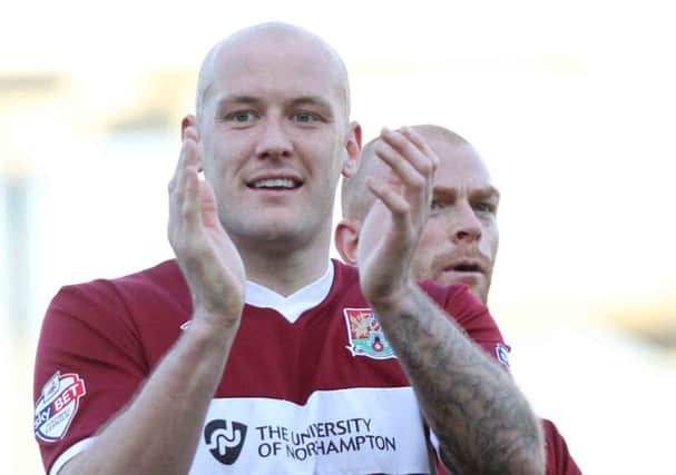 HAPPY MAN - Ryan Cresswell applauds the Cobblers supporters following Saturuday's win over Tranmere (Picture: Sharon Lucey)