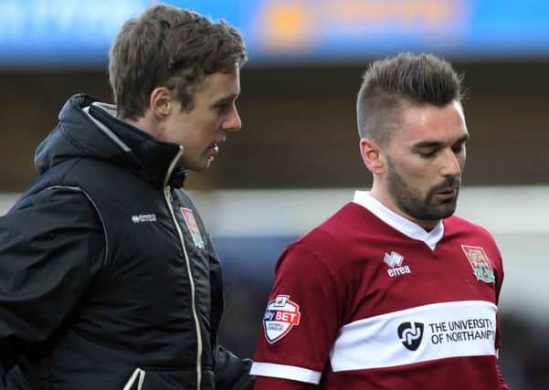 BIG BLOW - Cobblers winger Ricky Holmes will have a scan on a knee injury on Tuesday