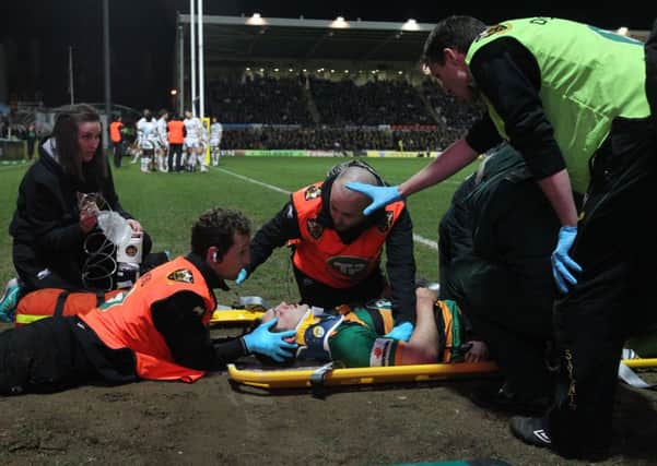 WORRYING MOMENT - George North is treated by the Saints medical staff after he was knocked out while scoring his team's second try against Wasps (Pictures: Sharon Lucey)