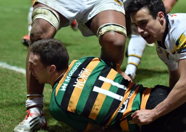 MOMENT OF IMPACT - George North collides with the knee of Wasps' Nathan Hughes at Franklin's Gardens on Friday night (Picture: Dave Ikin)