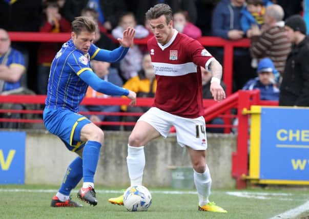 DOING THE HARD YARDS - as well as scoring twice, Jimmy Gray had to run his socks off as the lone striker for the Cobblers at Wimbledon (Pictures: Sharon Lucey)