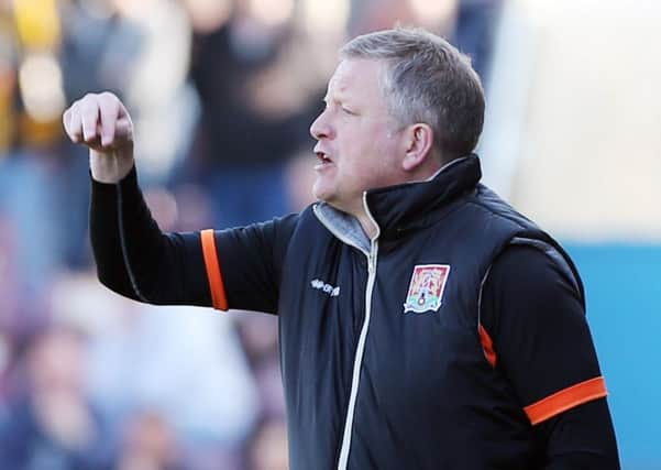 Cobblers boss Chris Wilder barks out the orders during Monday's clash with Cambridge (pictures: Kirsty Edmonds)
