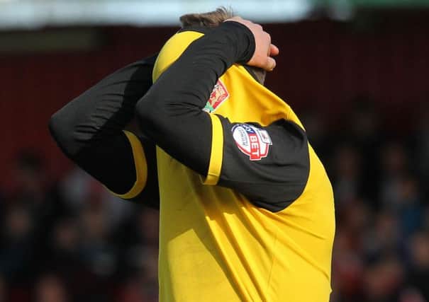 NOWHERE TO HIDE - Joel Byrom shows his disappointment following the defeat at Stevenage (Pictures: Sharon Lucey)