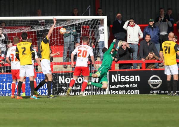 OVER AND OUT - Matt Duke is powerless to stop Simon Walton's 90th-minute winner for Stevenage (Pictures: Sharon Lucey)