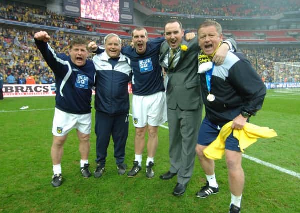 GLORY DAYS - Chris Wilder (right) celebrates winning promotion with Oxford United at Wembley in 2010. He makes his first return to the Kassam Stadium as Cobblers manager on Tuesday night
