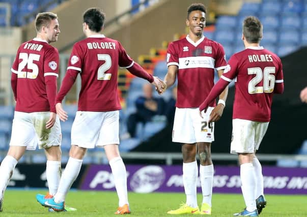 ALL SMILES - Cobblers striker Ivan Toney accepts the congratulations after scoring at Oxford United on Tuesday (Pictures: Kirsty Edmonds)
