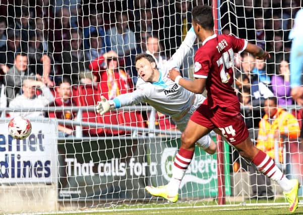 GET IN THERE - Ivan Toney scores the Cobblers' opener against Cheltenham on Saturday (Pictures: Sharon Lucey)
