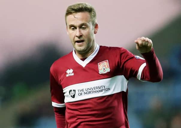 STAYING ON - Joel Byrom has signed a new two-year contract to stay at the Cobblers