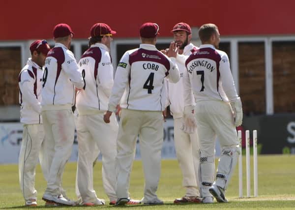 The Northants players celebrate finally dismissing Ashwell Prince in the draw against Lancashire
