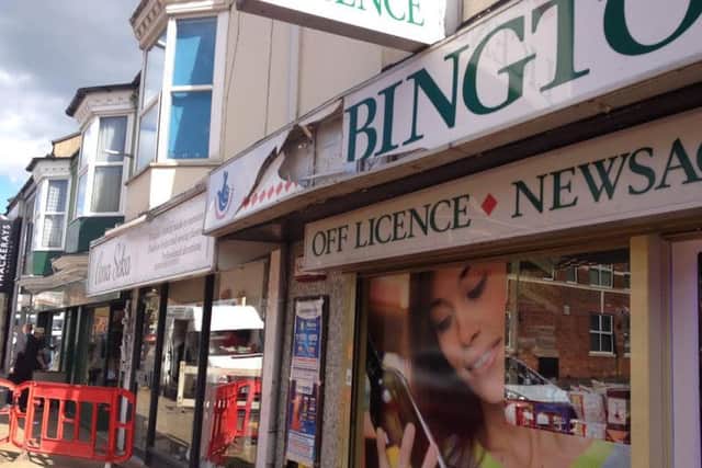 The scene outside Abington Supermarket in Wellingborough Road after a manhole explosion.