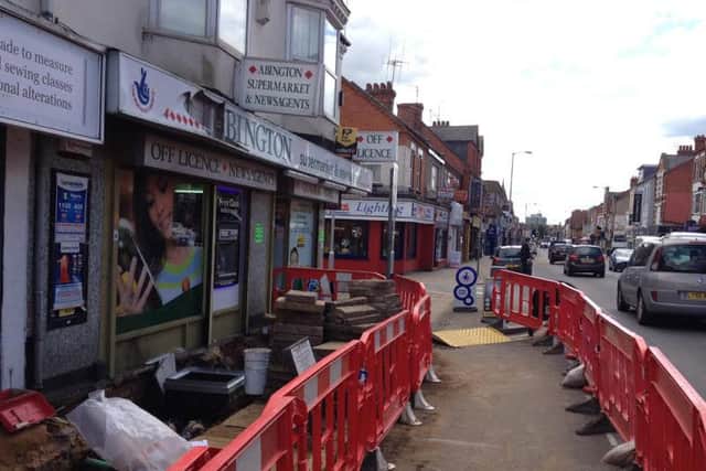 The scene outside Abington Supermarket after a manhole explosion