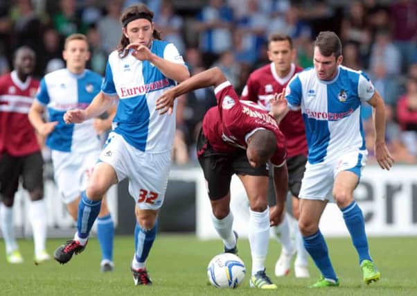 FLASHBACK - John-Joe O'Toole tussles with Ishmel Demontagnac during the Cobblers' 1-0 defeat at Bristol Rovers in August 2013, the last time the clubs met at the Memorial Stadium