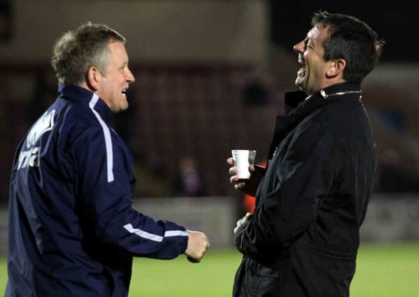 Cobblers boss Chris Wilder has had talks with Phil Brown about doing a deal for Southend defender Luke Prosser