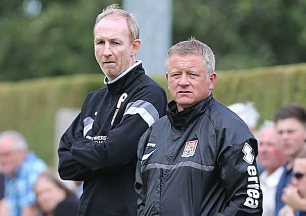 Cobblers assistant manager Alan Knill (left) and manager Chris Wilder
